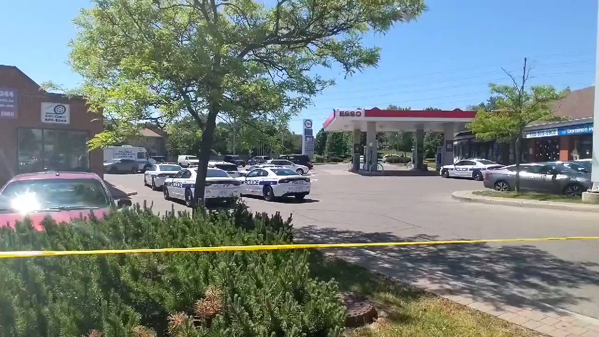 A homicide investigation is underway at this plaza on Glen Erin Drive and The Collegeway in Mississauga. @PeelPolice tell one person is dead, 4 others are in hospital following a shooting