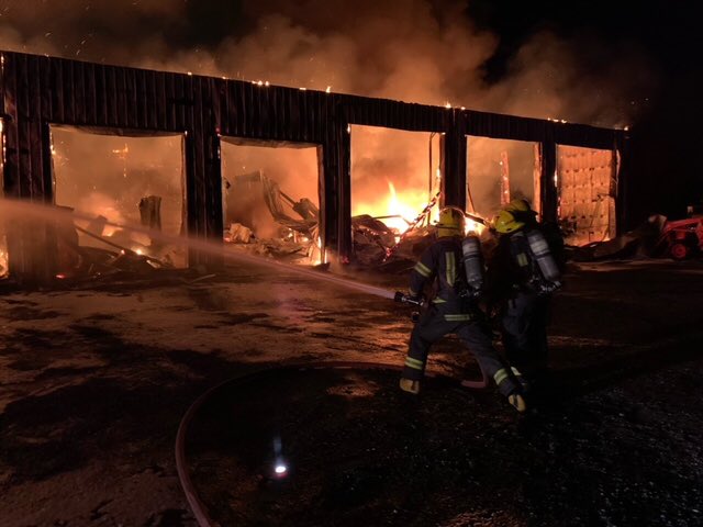 Investigation underway after this large fire in Langley Township destroyed a barn which contained several trucks and RVs.